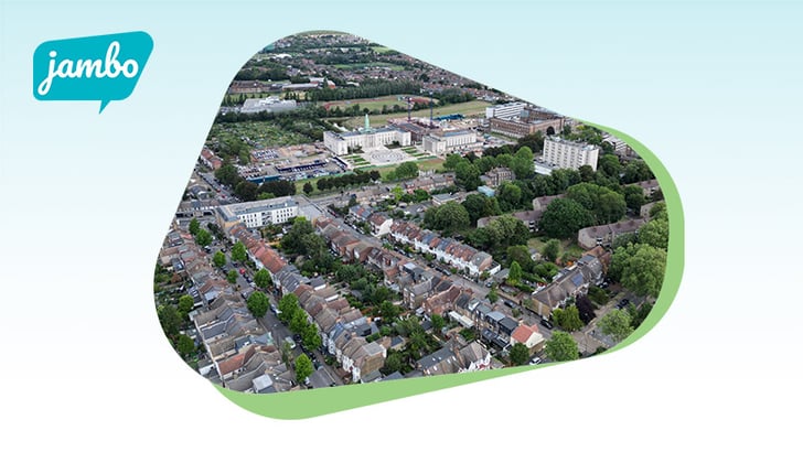 Aerial image of a UK community with a local government building in the background